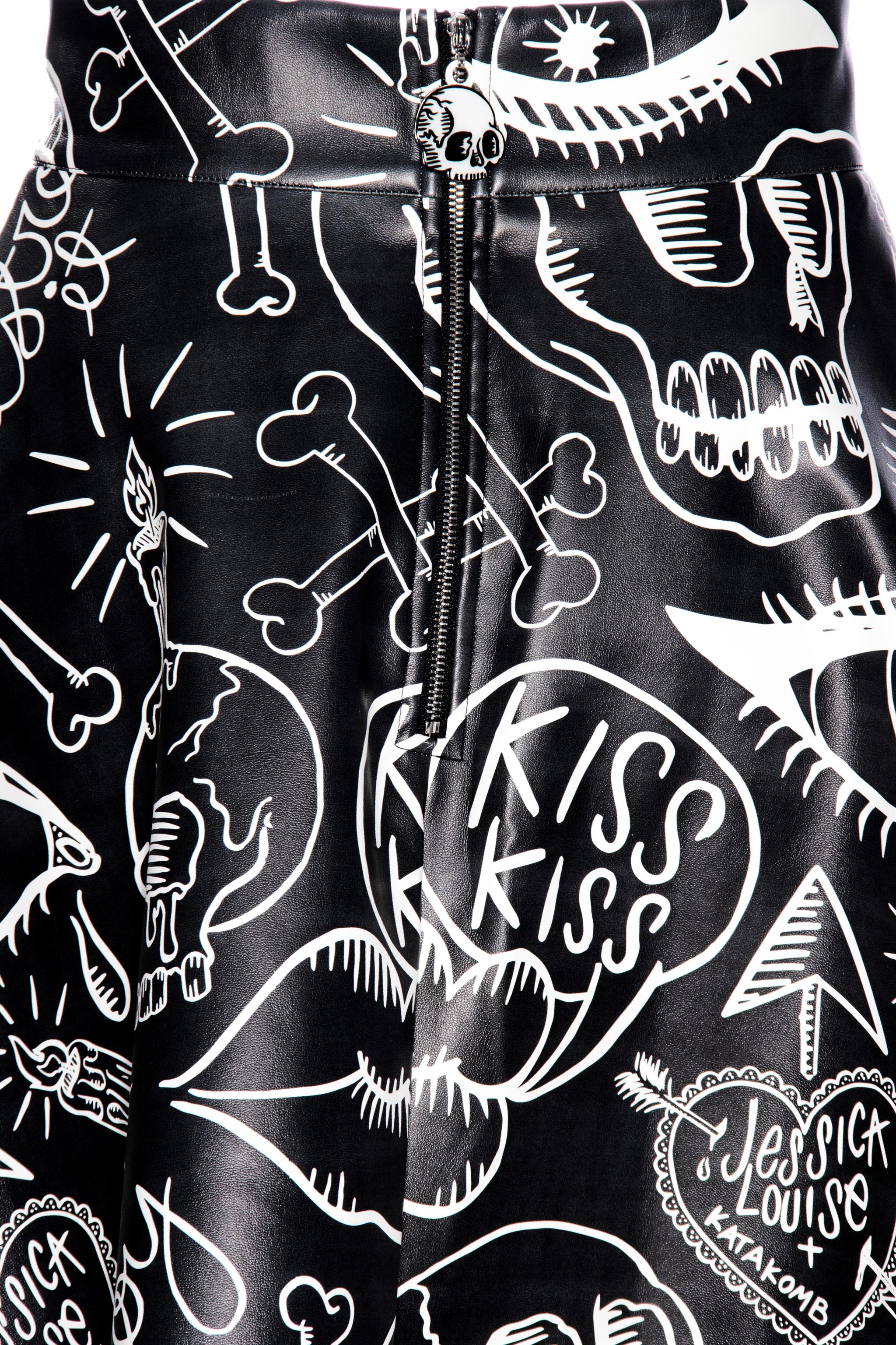 Get ready to rock out in style with our Moto Skater Skirt! Featuring bold Graffiti artwork by Jessica Louise, this high-waisted skirt is a statement piece that exudes attitude and flair.