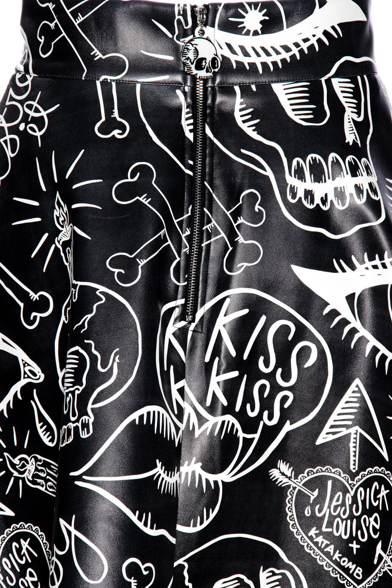 Get ready to rock out in style with our Moto Skater Skirt! Featuring bold Graffiti artwork by Jessica Louise, this high-waisted skirt is a statement piece that exudes attitude and flair.