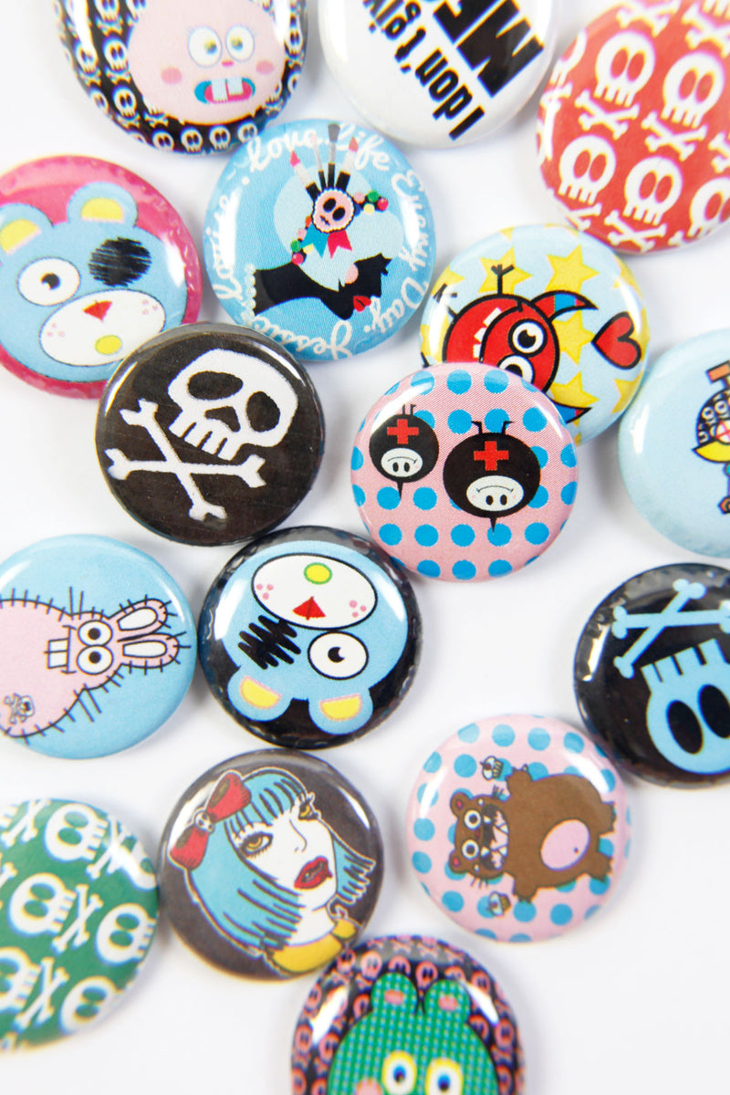Jessica Louise 1" pinback badges offer a unique showcase for her original illustrations. Each badge is securely attached with a metal pinback for a lasting keepsake. Perfect for collectors, badge enthusiasts, and art fans alike.